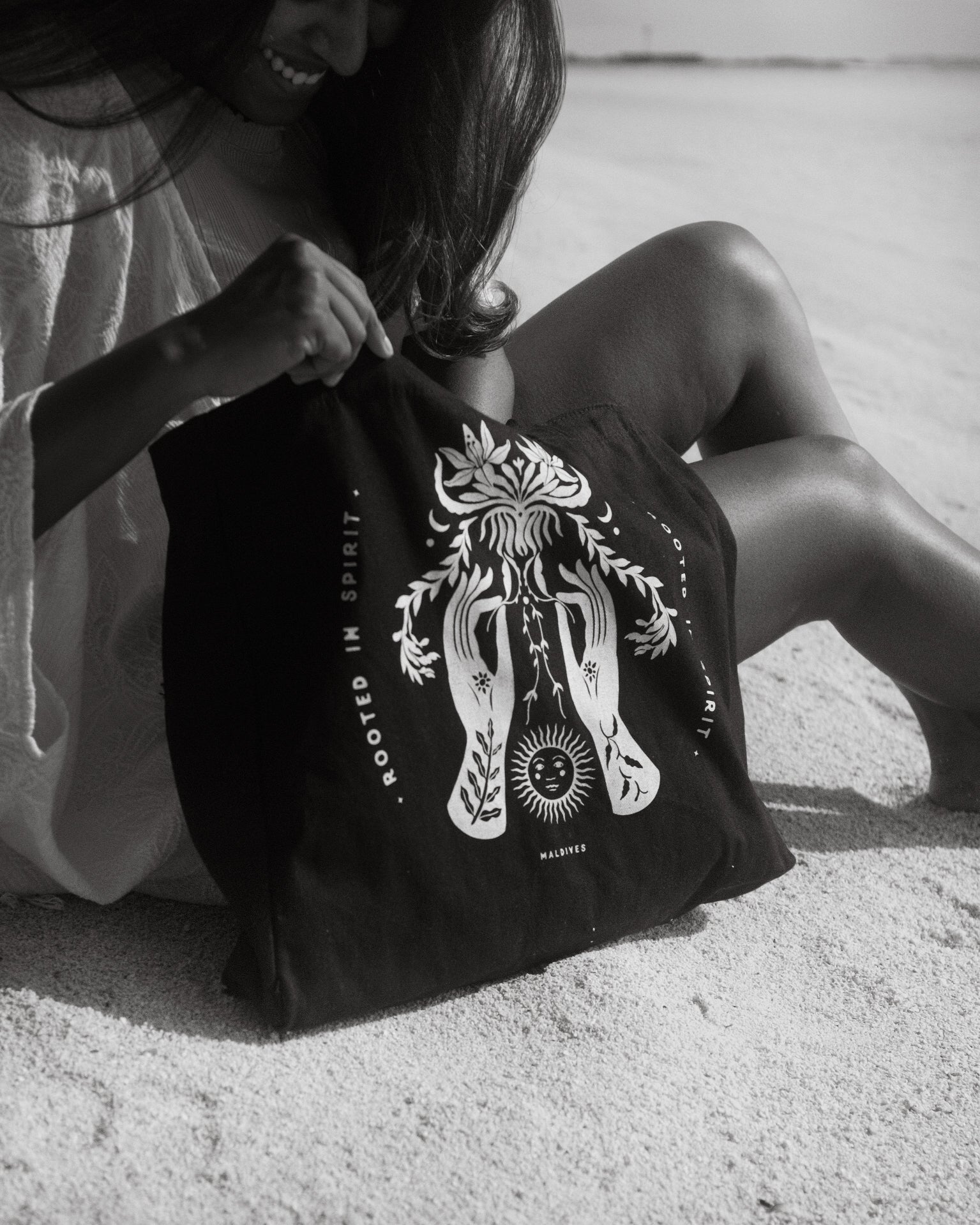Black tote with girl on the beach